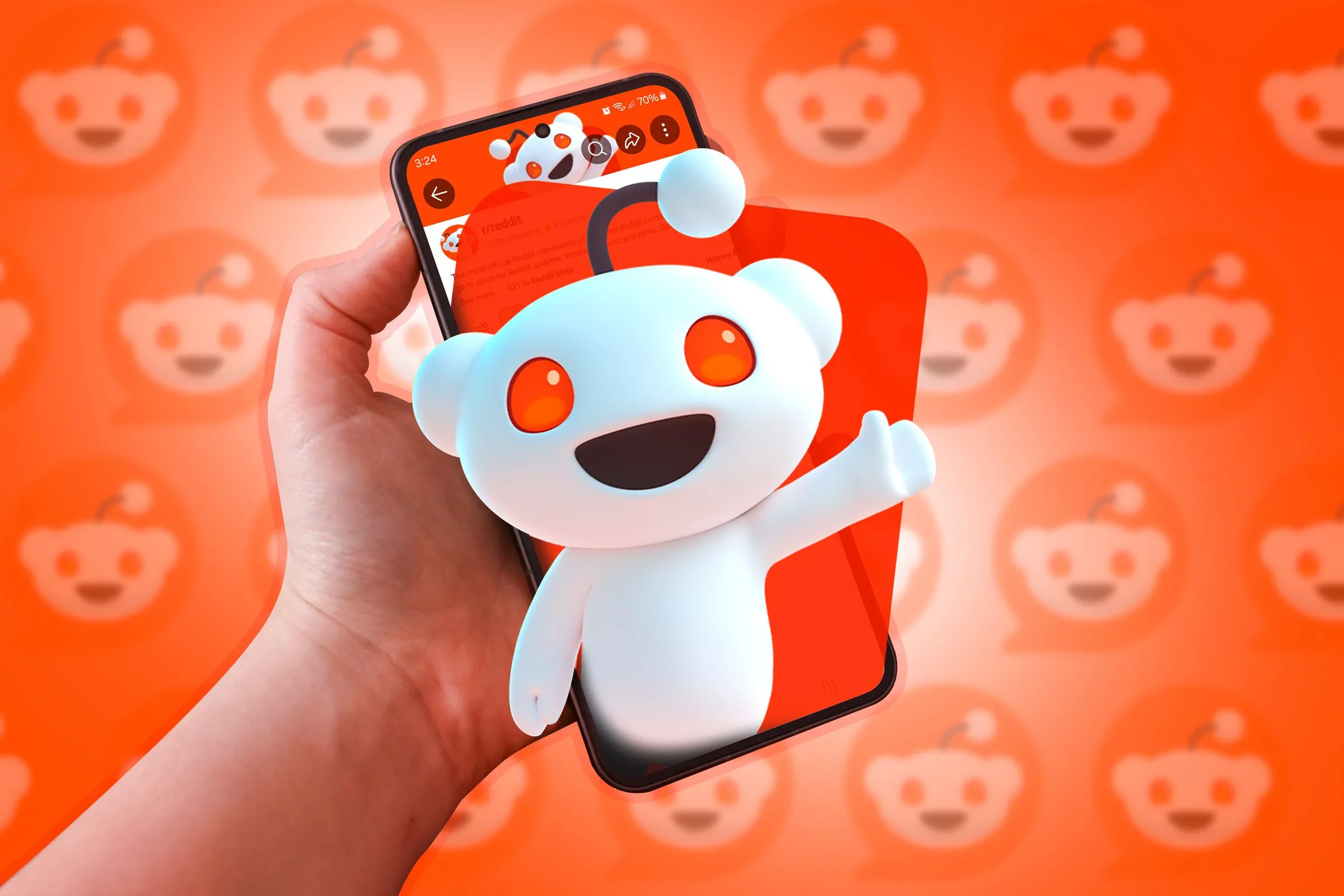 Điện thoại hiển thị linh vật Reddit nổi lên từ màn hình