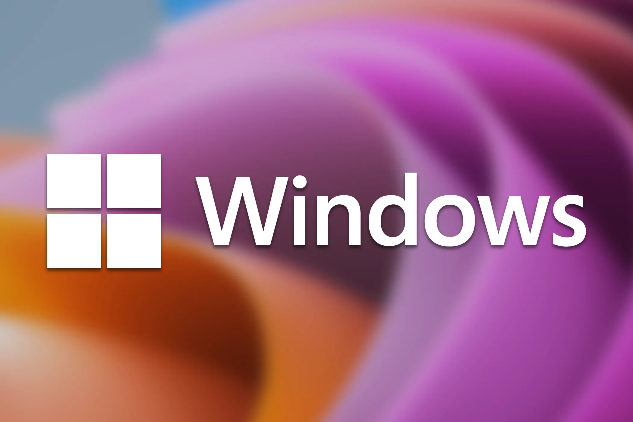 Logo Windows 11 và biểu tượng cập nhật, thể hiện việc Microsoft đang gỡ bỏ các rào cản để người dùng dễ dàng nâng cấp lên phiên bản 24H2.