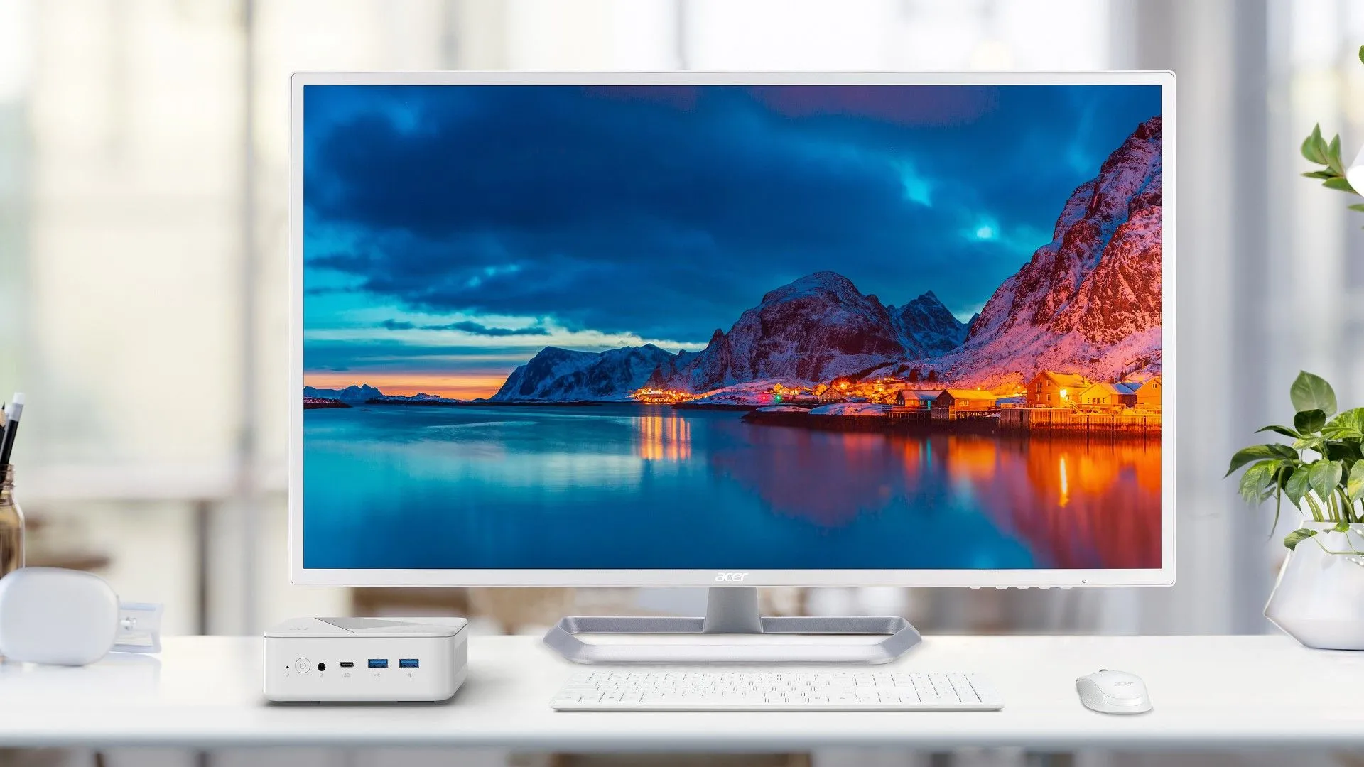 Máy tính mini Acer Revo Box AI đặt cạnh màn hình