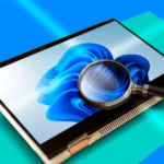 Máy tính Windows 11 với kính lúp tượng trưng cho việc giám sát nhân viên