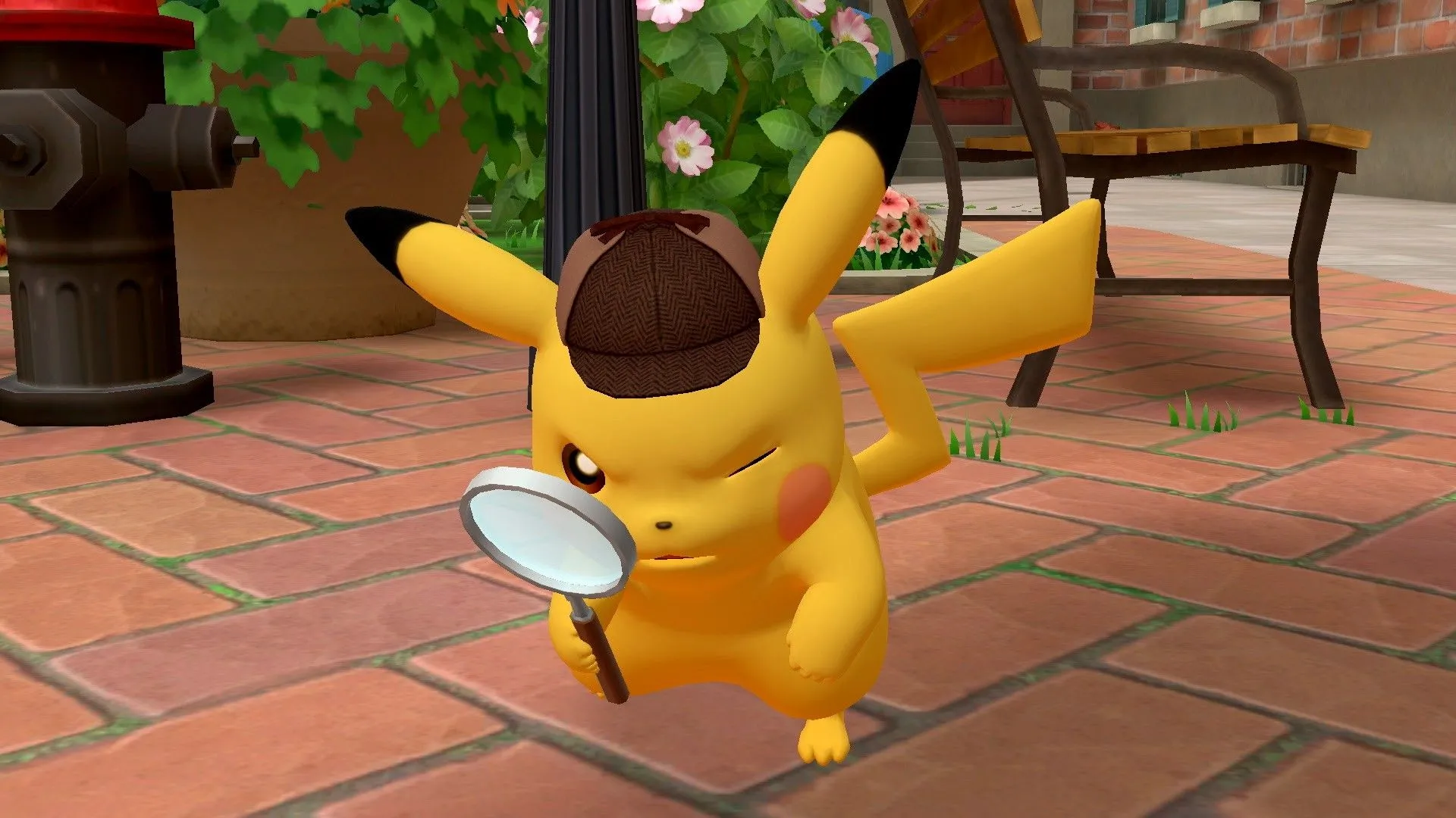 Pikachu thám tử đeo mũ và cầm kính lúp